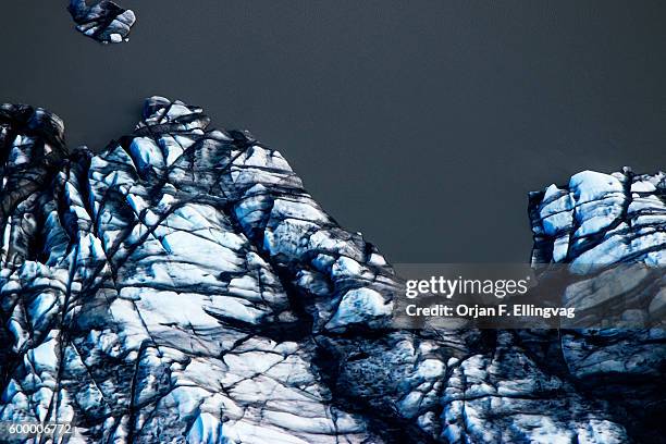 The Knik Glacier in Alaska. Lack of snow-cover expose the ash fallout from the nearby Redoubt Volcano, reducing the albedo effect. There are...