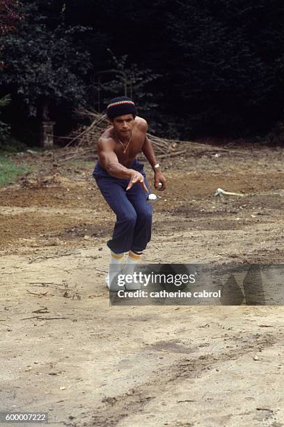 Tennis player Yannick Noah on vacation in the countryside.