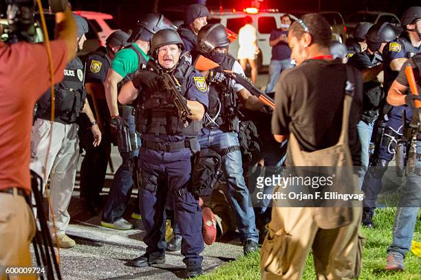 Heavily armed police in riot gear provoked many of the protesters as they stormed in guns pointing to arrest deemed "troublemakers" among the...