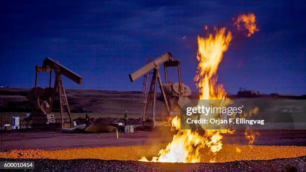 Flames from a flaring pit near a well in the Bakken Oil Field. The primary component of natural gas is methane, which is odorless when it comes...