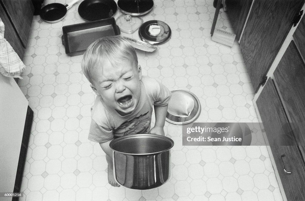 BOY PLAYING WITH POTS AND PANS, SCREAMING