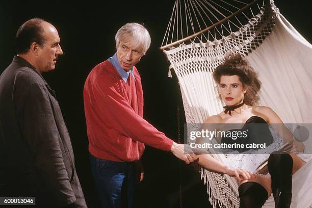 French actor Michel Piccoli, director Michel Deville and actress Fanny Ardant on the set of the film "Le Paltoquet", directed by Deville.