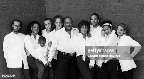 American composer and producer Quincy Jones relaxes with members of his family at home.