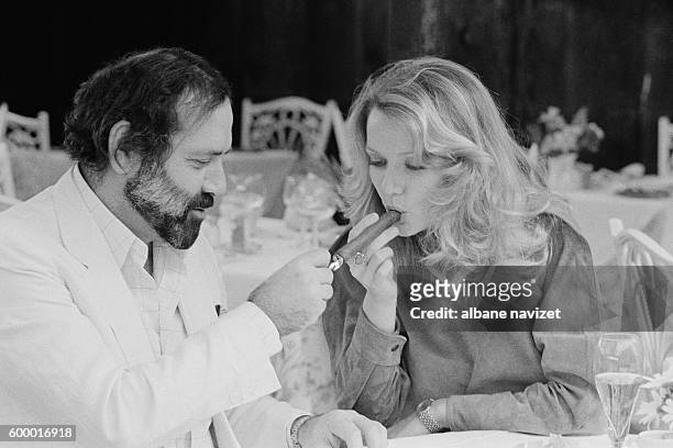 French actor, director and producer Jean Yanne and his partner actress Mimi Coutelier.
