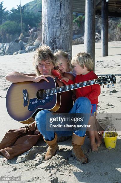 Scottish singer Rod Stewart relaxes with his children Kimberly and Sean.