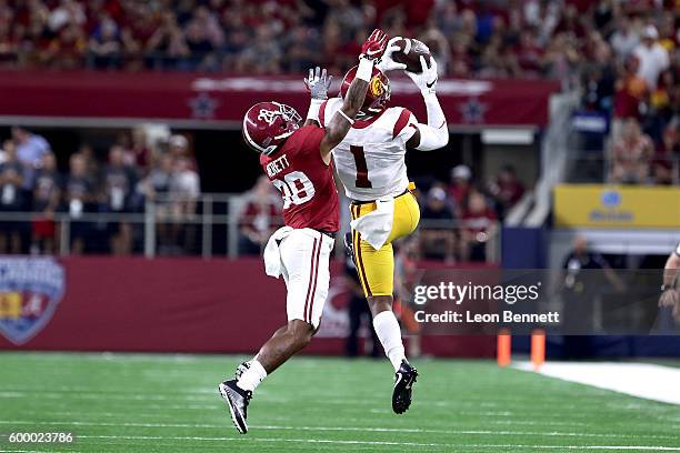 Darreus Rogers of the USC Trojans catches a pass against Anthony Averett of the Alabama Crimson Tide in the first quarter during the AdvoCare Classic...