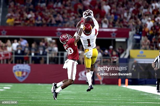 Darreus Rogers of the USC Trojans catches a pass against Anthony Averett of the Alabama Crimson Tide in the first quarter during the AdvoCare Classic...