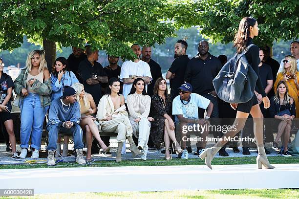 Tyga, Kylie Jenner, Kendall Jenner, Kim Kardashian, Carine Roitfeld and Pharrell Williams attend the Kanye West Yeezy Season 4 fashion show on...