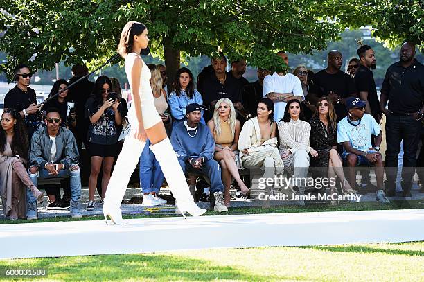 Tyga, Kylie Jenner, Kendall Jenner, Kim Kardashian, Carine Roitfeld and Pharrell Williams attend the Kanye West Yeezy Season 4 fashion show on...