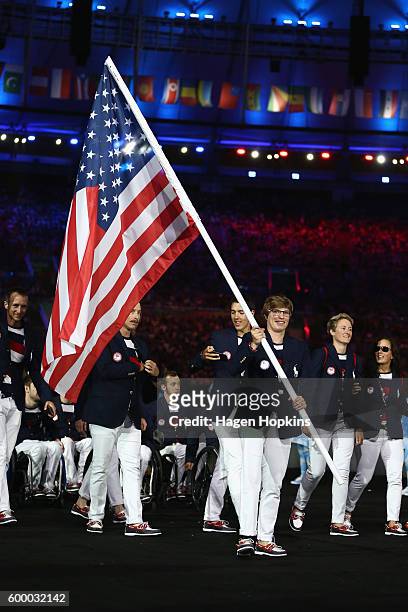 Flag bearer Allison Jones of the United States leads the team entering the stadium during the Opening Ceremony of the Rio 2016 Paralympic Games at...