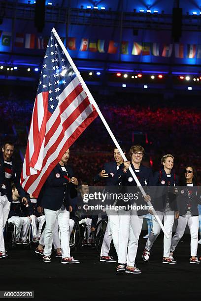 Flag bearer Allison Jones of the United States leads the team entering the stadium during the Opening Ceremony of the Rio 2016 Paralympic Games at...