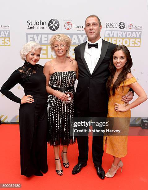 Richard Tucker winner of the Everyday Hero of The Year award, with Bridget Massey and award presenters Hannah Spearritt and Louisa Lytton, at the St...