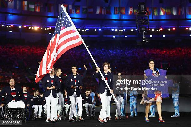 Flag bearer Allison Jones of the United States leads the team entering the stadium during the Opening Ceremony of the Rio 2016 Paralympic Games at...