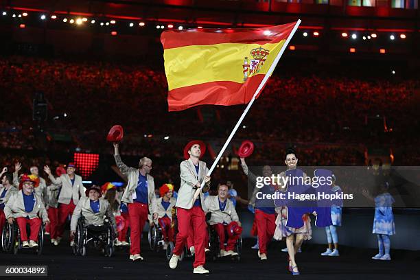 Flag bearer Jose Manuel Ruiz Reyes of Spain leads the team entering the stadium during the Opening Ceremony of the Rio 2016 Paralympic Games at...