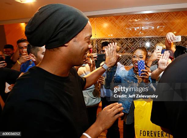 Ronaldhino greets FC Barcelona fans at Niketown to celebrate the Club's arrival to New York on September 7, 2016 in New York City.