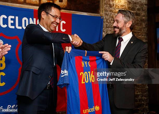 Josep Maria Bartomeu, President of FC Barcelona, gifts a personalized team jersey to Jordi Getman-Eraso, President of Penya FC Barcelona New York...
