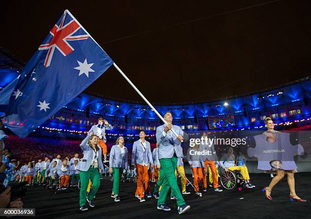 Bradley Ness, representing Australia in Wheelchair Basketball, leads his fellow athletes into the arena during the Opening Ceremony of the Rio 2016...