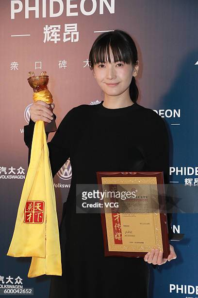 Actress Li Yuan poses during the 20th Huading Awards and China Film Satisfaction Survey Release Ceremony at Kowloon Bay International Trade &...