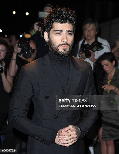 Zayn Malik arrives for the Tom Ford Autumn/Winter 2016 Menswear and Womenswear Collection presentation in New York on September 7, 2016 / AFP /...