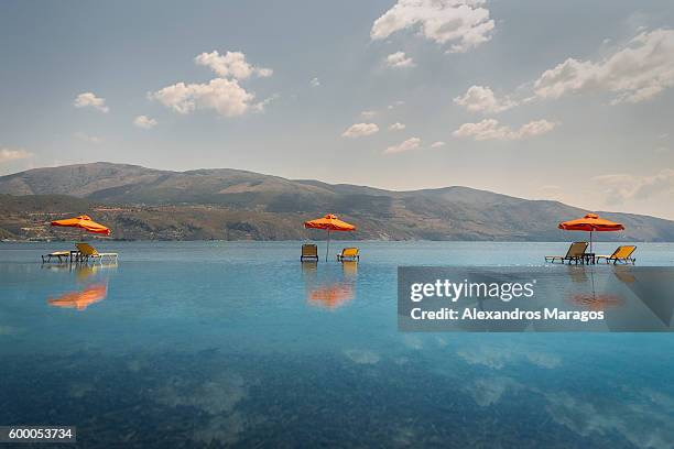 beach chairs in kefalonia, greece - alexandros maragos stock pictures, royalty-free photos & images