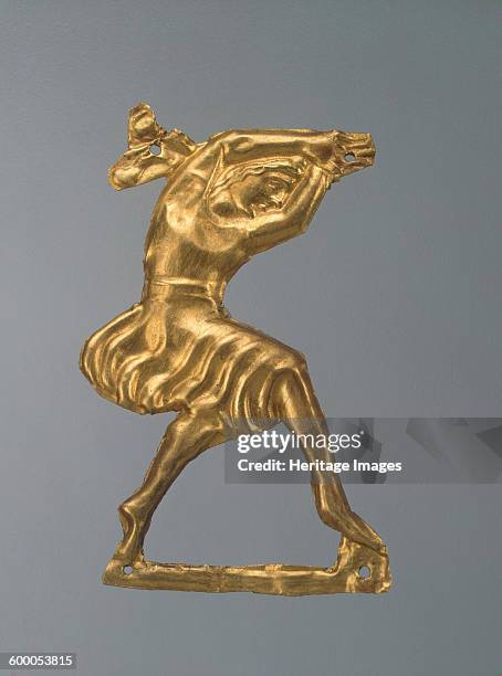 Gold plaque in the form of a dancing woman, 330-300 BC. Found in the collection of State Hermitage, St. Petersburg. Artist : Ancient jewelry.