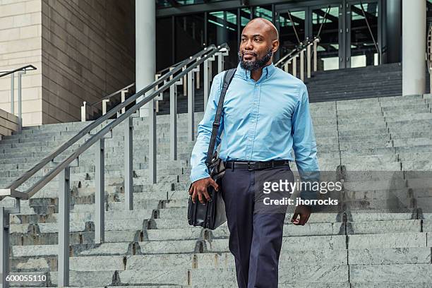 casual african american businessman in blue - businessmen casual not phone walking stock pictures, royalty-free photos & images