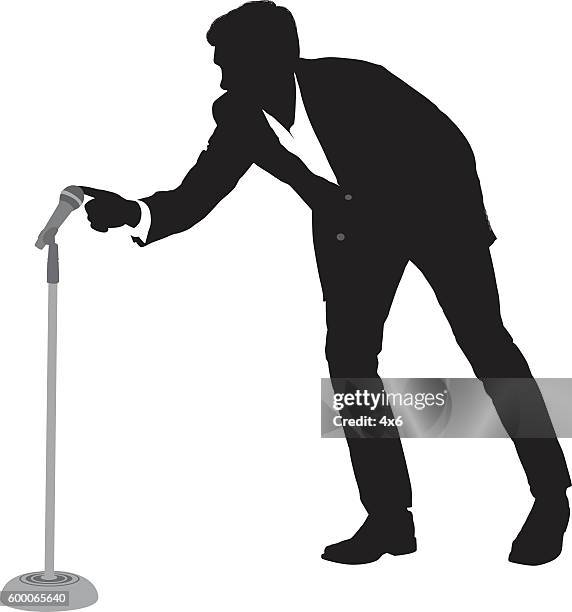 businessman touching the microphone - microphone stand stock illustrations