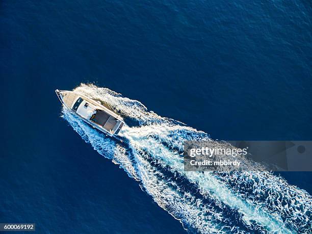 speedboat racing at the open sea - speed boat top view stock pictures, royalty-free photos & images