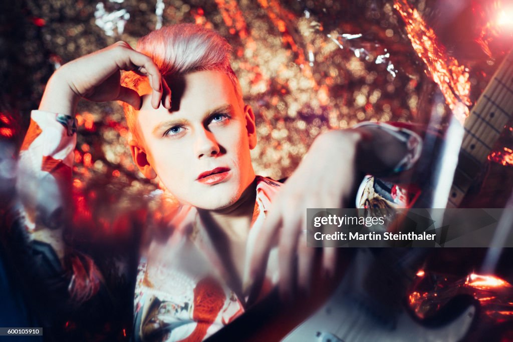Glam rock musician / rockstar with guitar