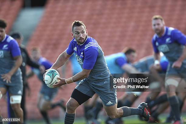 Aaron Cruden of the All Blacks runs with the ball during the New Zealand All Blacks training session at Waikato Stadium on September 8, 2016 in...
