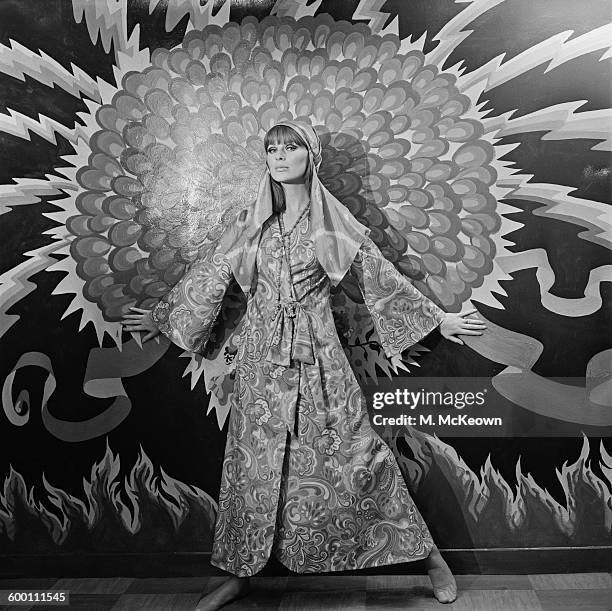 English fashion model Paulene Stone wearing a psychedelic robe to be sold in the new Apple Boutique in London, UK, 29th November 1967. The shop was...