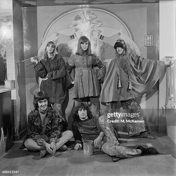 English fashion model Paulene Stone with members of The Fool design collective at the new Apple Boutique in London, UK, 29th November 1967. The shop...