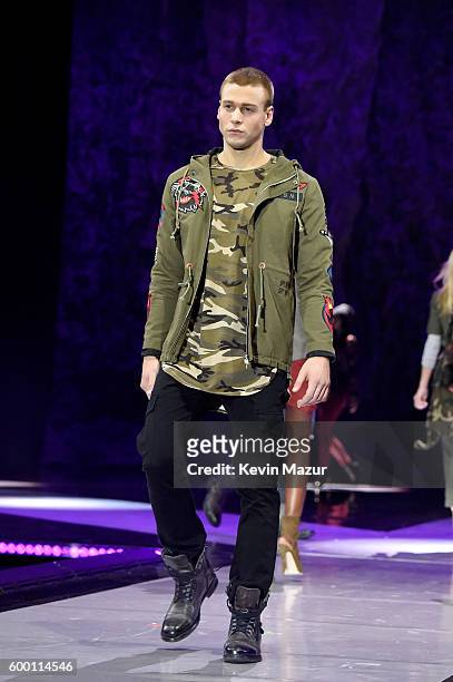 Models walk the runway as Macy's Presents Fashion's Front Row kicks-off New York Fashion Week at The Theater at Madison Square Garden on September 7,...