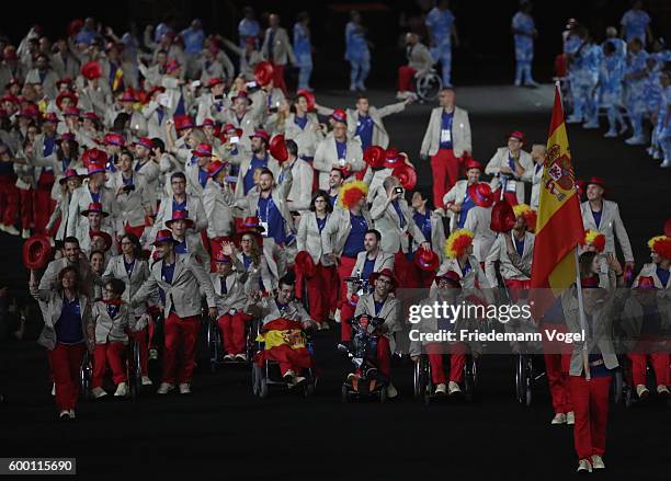 Flag bearear Jose Manuel Ruiz Reyes of Spain leads the team entering the stadium during the Opening Ceremony of the Rio 2016 Paralympic Games at...