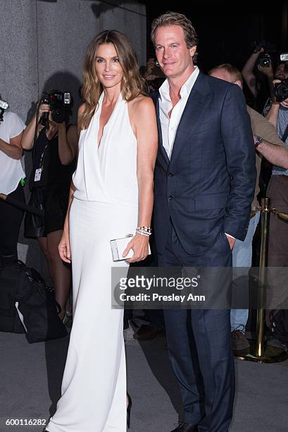 Rande Gerber and Cindy Crawford attend Tom Ford fashion show during New York Fashion Week at 99 East 52nd Street on September 7, 2016 in New York...
