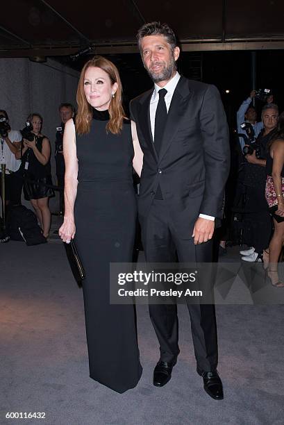 Julianne Moore and Bart Freundlich attend Tom Ford fashion show during New York Fashion Week at 99 East 52nd Street on September 7, 2016 in New York...