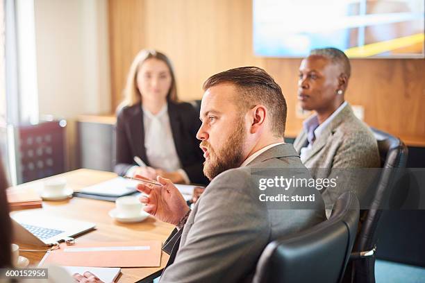 corporate meeting discussions - law office stock pictures, royalty-free photos & images