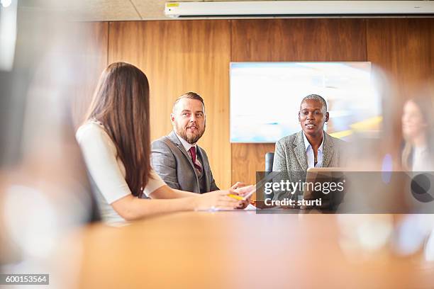 business meeting - androgynous professional stock pictures, royalty-free photos & images