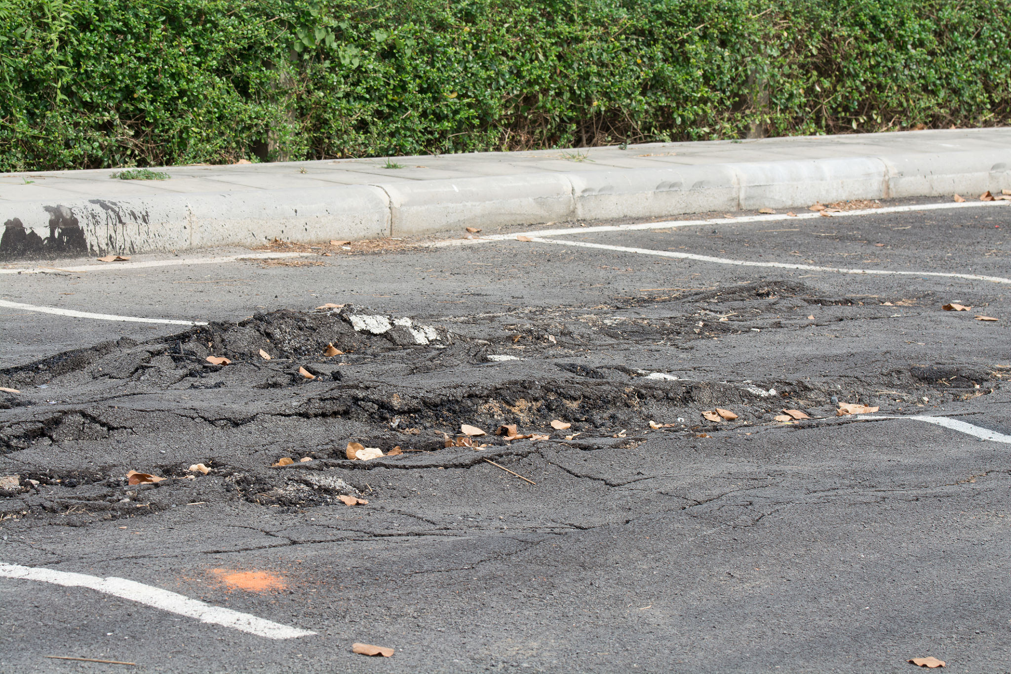 damaged parking lot