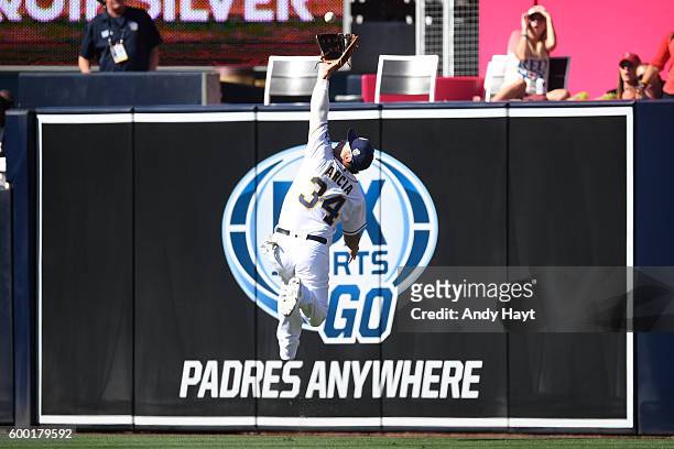 Oswaldo Arcia of the San Diego Padres attempts a catch in right field during the game against the Boston Red Sox at PETCO Park on September 5, 2016...