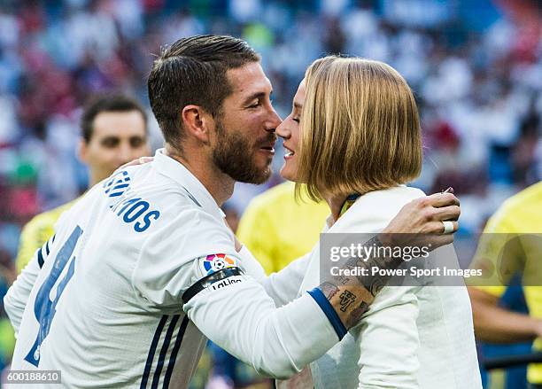 Spanish swimmer Mireia Belmonte Garcia is greeted by Real Madrid's player Sergio Ramos before the La Liga match between Real Madrid vs RC Celta de...