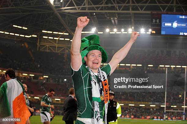 Brian O'Driscoll of Ireland celebrates his team's Grand Slam victory following the RBS 6 Nations Championship match between Wales and Ireland at the...