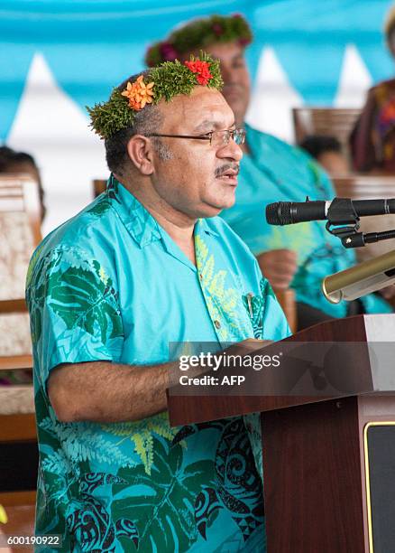 Papua New Guinea Prime Minister Peter ONeill addresses members of the 16-nation Pacific Islands Forum at the meeting's opening in the Micronesian...
