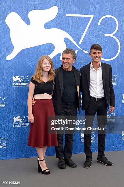 Actress Ecem Uzun, director Reha Erdem and actor Berke Karaer attend a photocall for 'Big Big World' during the 73rd Venice Film Festival at Palazzo...