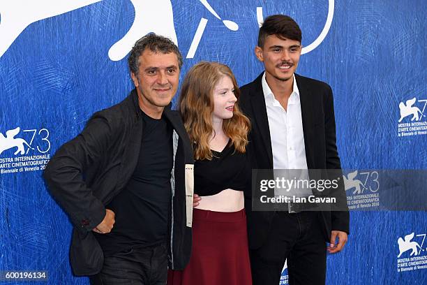 Actress Ecem Uzun, director Reha Erdem and actor Berke Karaer attend a photocall for 'Big Big World' during the 73rd Venice Film Festival at Palazzo...