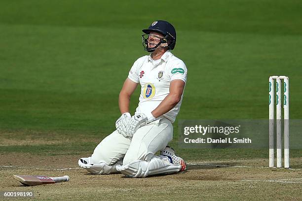 Barry McCarthy of Durham reacts after being hit by a delivery from Ryan Sidebottom of Yorkshire during Day Three of the Specsavers County...
