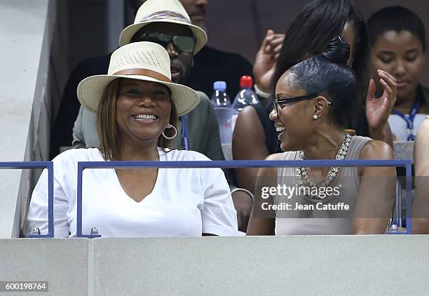 Queen Latifah and Eboni Nichols cheer for their friend Serena Williams during day 10 of the 2016 US Open at USTA Billie Jean King National Tennis...