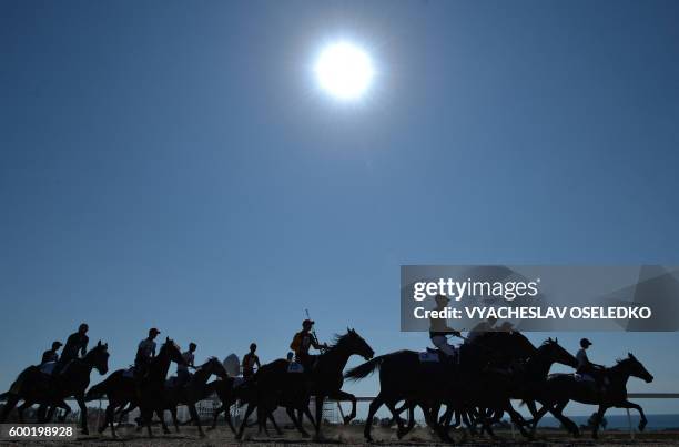 Riders compete in a horse race during the World Nomad Games 2016 in Cholpon-Ata on the shores of Lake Issyk-Kul, some 270 kms outside the capital...