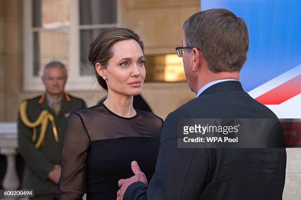 Special Envoy, Angelina Jolie speaks to US Defence Secretary Ash Carter at the UN Peacekeeping Defence Ministeriall at Lancaster House on September...