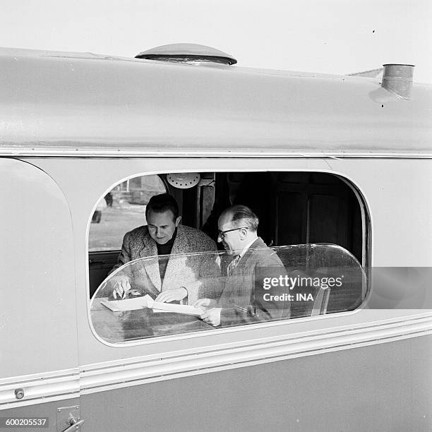 Henri Kubnick and Jean Coupant, director of the Circus 58 in a caravan of the circus.